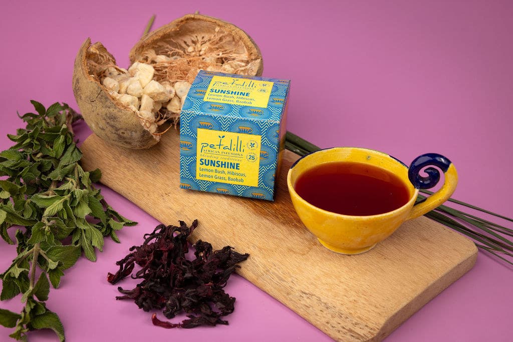 A box of Sunshine with baobab, hibiscus and lemon bush on a board
